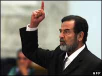 Former Iraqi President Saddam Hussein yells at the court as he receives his verdict 